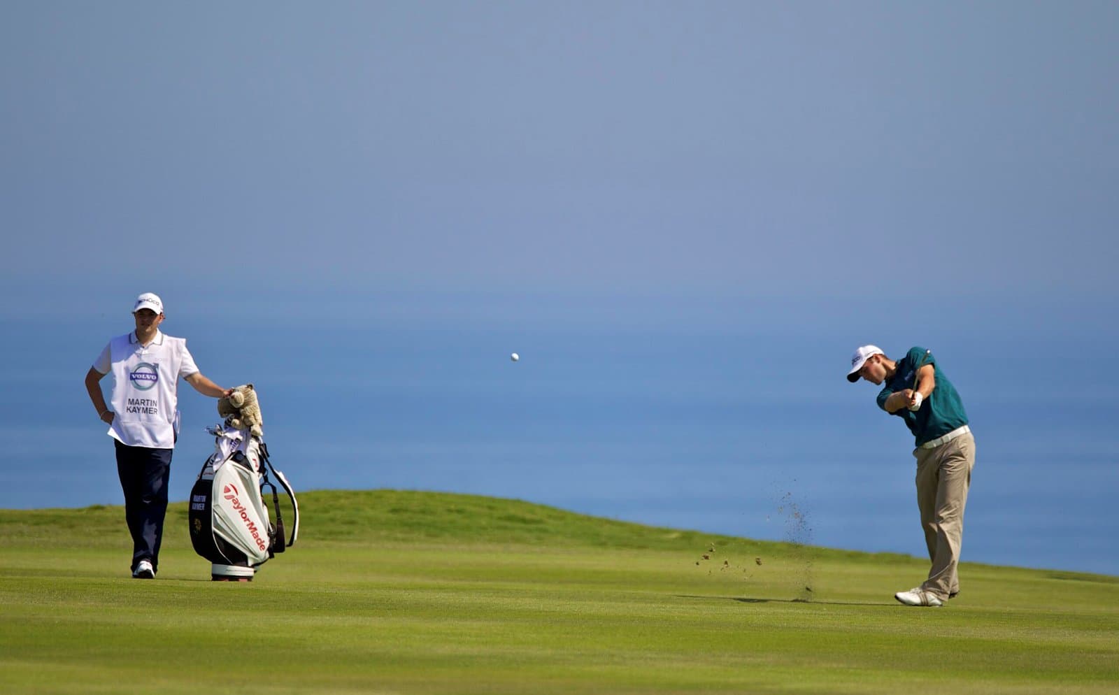 A player hits a fairway shot with the Mediterranean behind during a Volvo World Match Play Championship at Finca Cortesín.