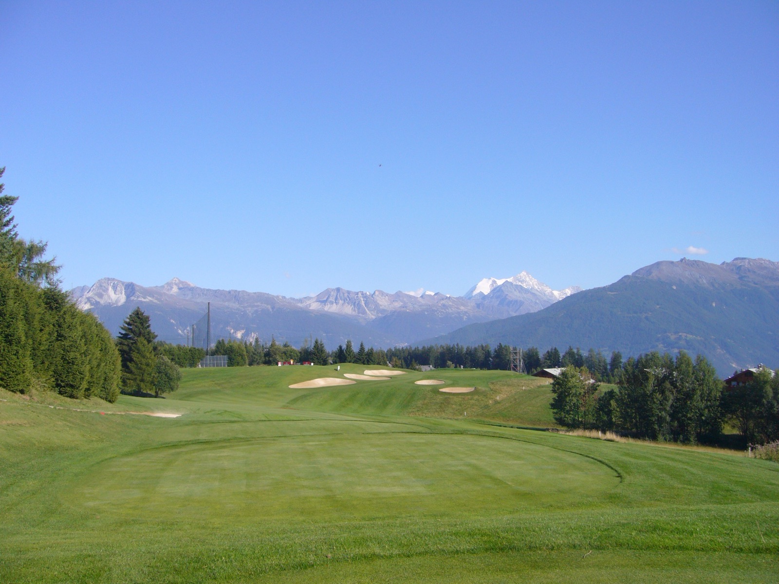 The view over the Alps from the 7th tee at Crans-sur-Sierre Golf Club, Crans-Montana, Switzerland.