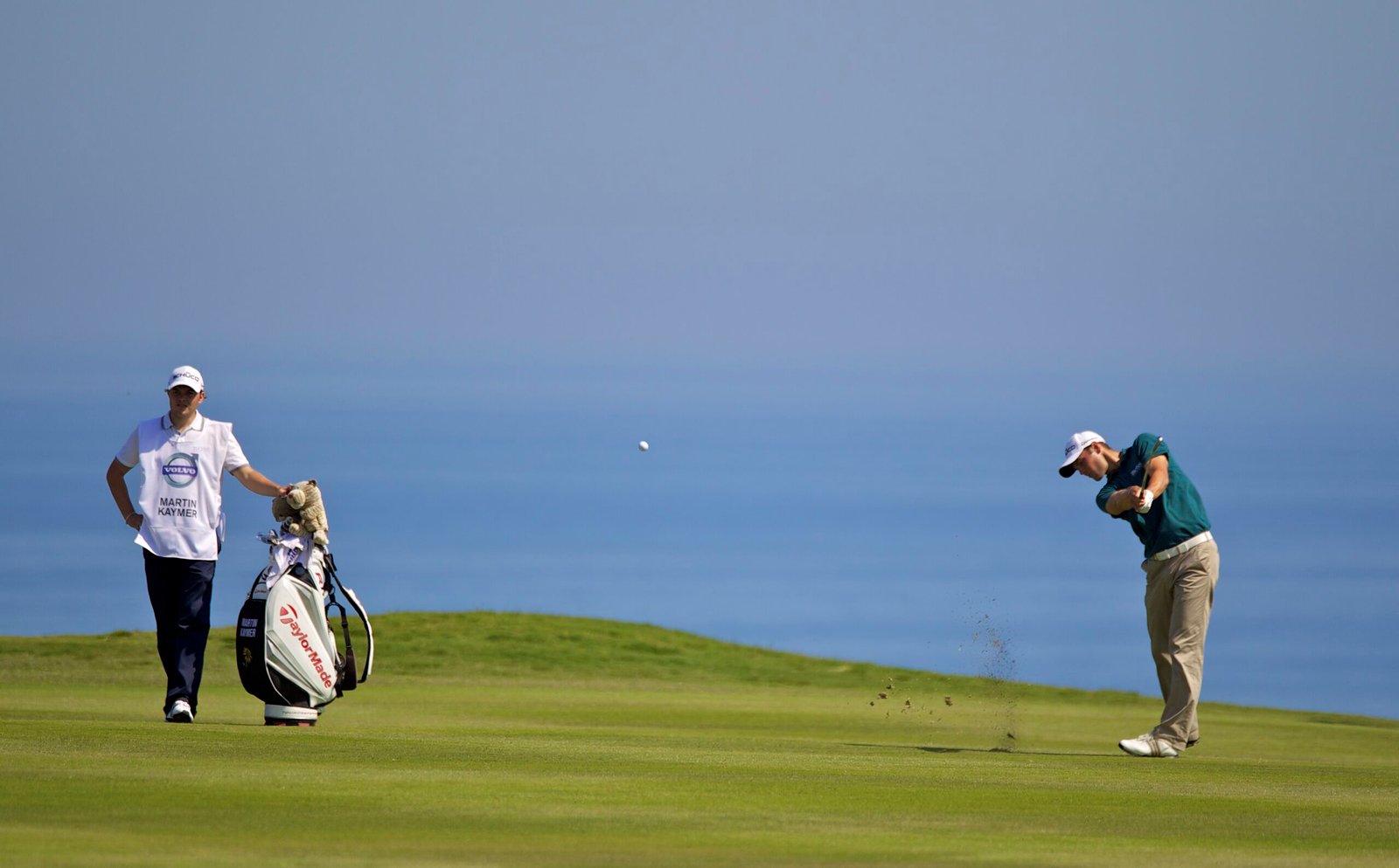 A player hits a fairway shot with the Mediterranean behind during a Volvo World Match Play Championship at Finca Cortesín.