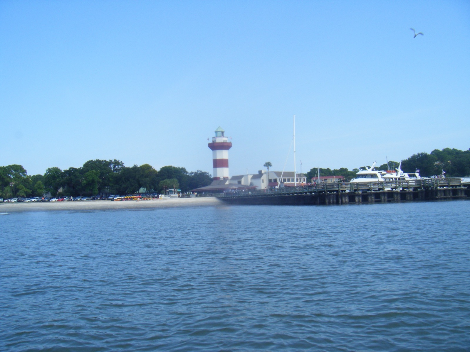 The red-and-white Harbour Town Lighthouse and marina at Sea Pines, Hilton Head Island, seen from Calibogue Sound.