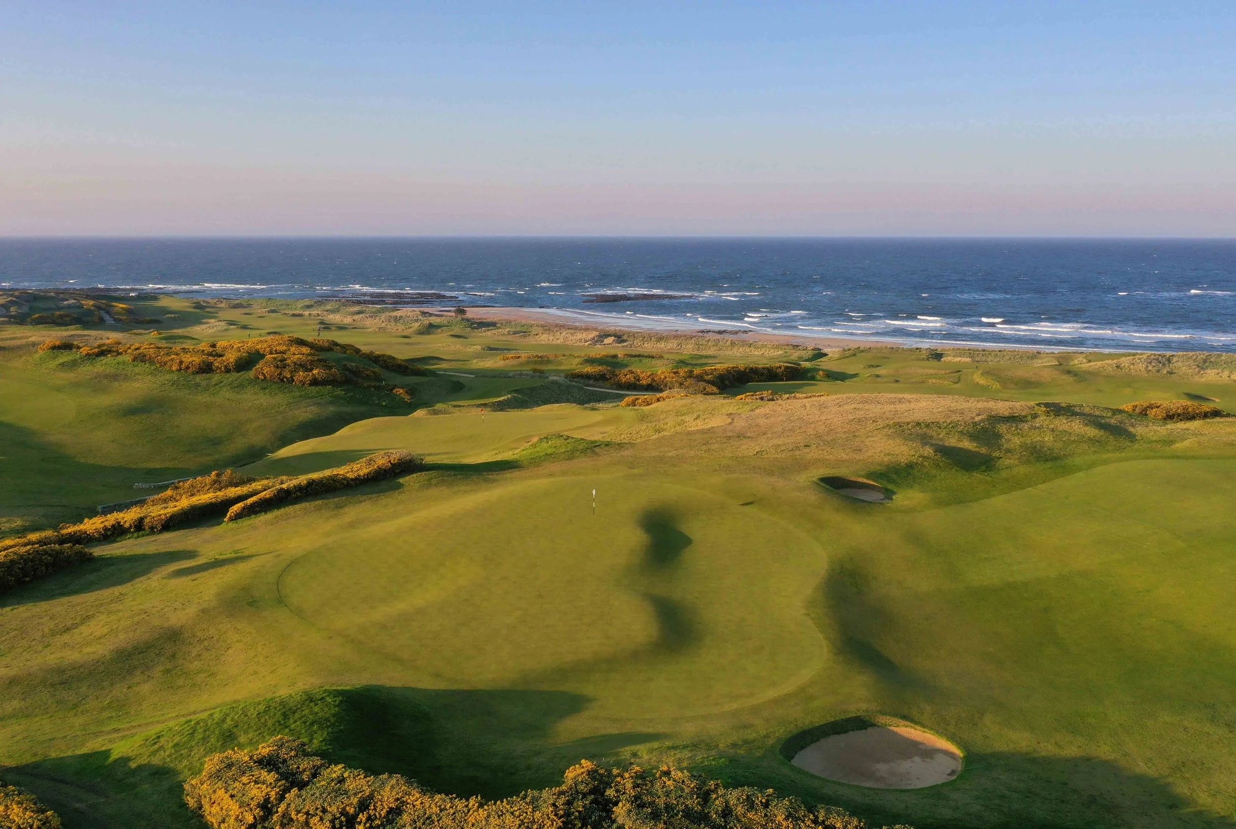 Aerial view of the 9th hole and gorse at Kingsbarns Golf Links on the Fife coast, Scotland.