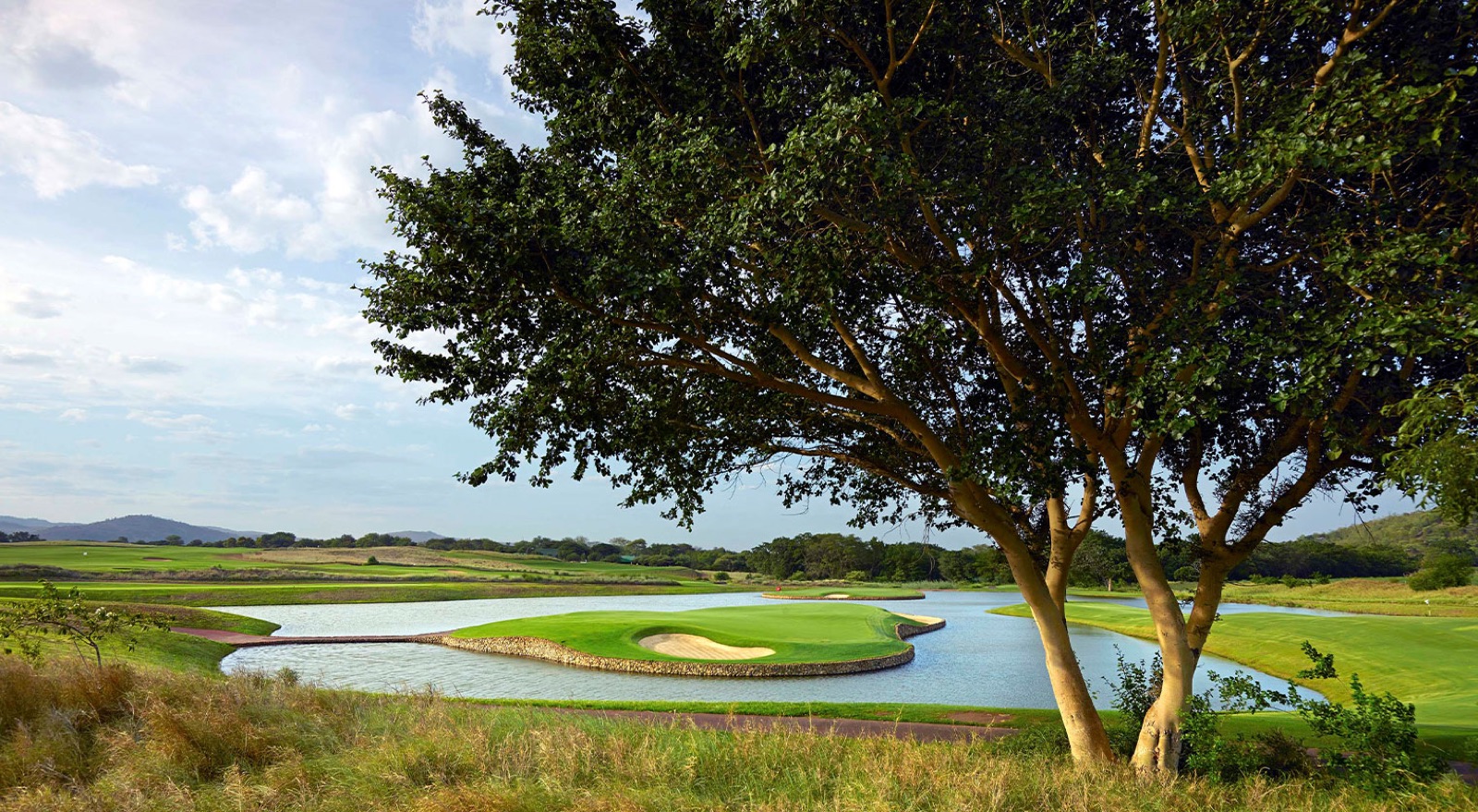 A water-guarded green on the Gary Player-designed course at Leopard Creek, Mpumalanga, South Africa.