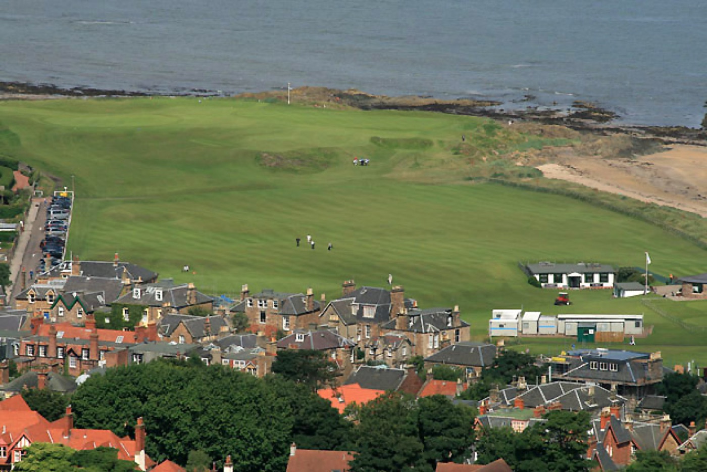 The 1st and 18th fairways of the West Links beside the town of North Berwick, seen from above.
