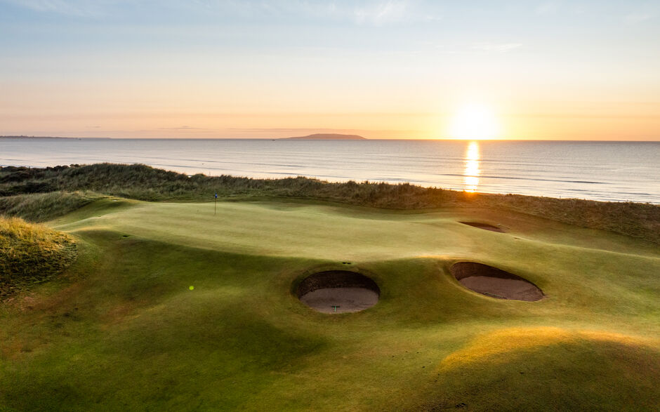 A fairway and green on the links at Portmarnock Golf Club, County Dublin, Ireland.